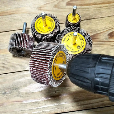 10 Piece One Quarter Inch Abrasive Flap Wheel Sander Set With Aluminum Oxide Flap Wheels For Rotary Tools on wooden surface