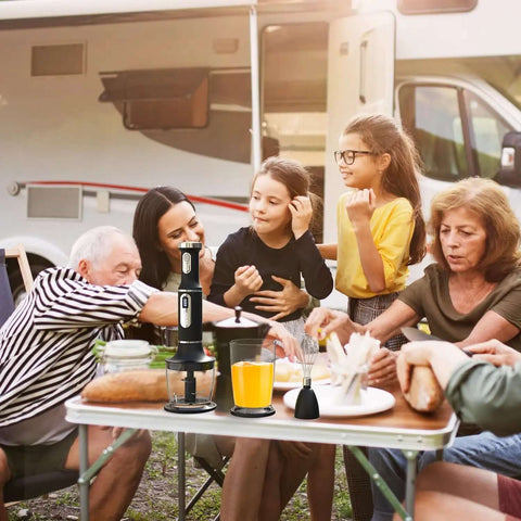 Cordless Immersion Blender Handheld Mixer With Extended Battery Life And Fast Usb Charging For Smooth Pureeing and family outdoor gathering with orange juice.