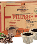 Box of Brown Unbleached Coffee Filters For Reusable Single Serve Pods Natural Paper That Keeps Grounds Out 300 Count with coffee beans.