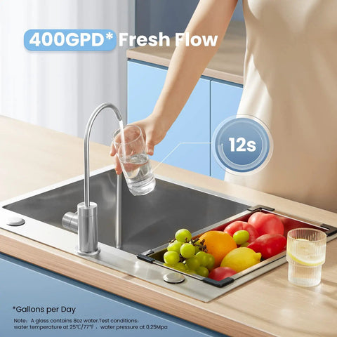 Person filling glass with Top-Notch Tankless Reverse Osmosis System 400 GPD With 7-Stage Filtration For Under-Sink Drinking Water