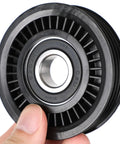 Checkmate Your Cool System With This Sick Sekpktf A/C Pulley Belt Adjuster Kit Perfect For Subaru Baja And Impreza Models From Late 90s To Mid 2000s Built Tough For Daily Grind Reliable Performance Meets Street Swag In Sleek Black Finish. black A/C pulley belt adjuster wheel, close-up with bearing