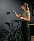 Heavy Duty Mountain Bike Battery Charging Holder With Tool-Free Nylon Storage Rack For Secure Wall Mount Drop Protection Tidy Garage And Workshop E-Bike Organizer Charger Shelf Off Ground mounted on garage wall