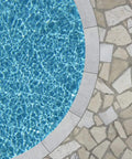 Bird's-eye view of a round pool with Waterborne Semi Gloss Acrylic Pool Paint Ocean Blue 1 Gallon DIY Friendly For Fresh Or Saltwater Pools Quick Drying Lasting Color Protective Finish Over Properly Prepped Surfaces, adjacent to stone tile deck.