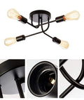 Industrial Semi Flush Mount Four Light Ceiling Fixture with adjustable black metal branches, E26 base, vintage style lighting.