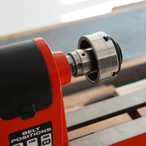 Side view of metal 1x8 TPI to 1-1/4x8 TPI thread adaptor with jackscrews for woodworking lathe headstock.