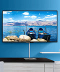 TV Cord Hider 42 Inch Cord Cover For Large Cable Management installed under wall-mounted TV on blue wall, concealing cables.