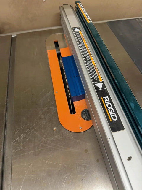 Fence Alignment Tool With Magnetic Stackable Bars For Quick Table Saw Fence Setup And Precise Blade To Fence Spacing Router Bit Height Ruler And Tooth Notch For Woodworking installed on a table saw with orange and blue components.