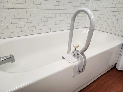 White Bathtub Rail With Wide Grip For Bathroom Safety installed on tub, showing adjustable clamp and non-slip support for seniors.