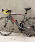 Road bike with "Flat Pedals For Mountain Road And Gravel Bikes Lightweight 154.5 Grams Each Wide Foot Surface Nine Sixteenth Inch" installed.