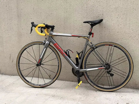 Road bike with "Flat Pedals For Mountain Road And Gravel Bikes Lightweight 154.5 Grams Each Wide Foot Surface Nine Sixteenth Inch" installed.