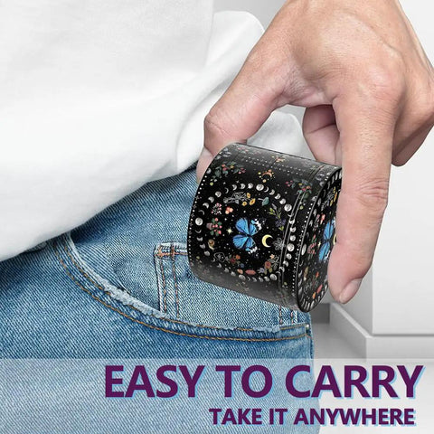 Black Manual Spice Grinder For Kitchen Use with a decorative design being placed in a pocket for easy portability.
