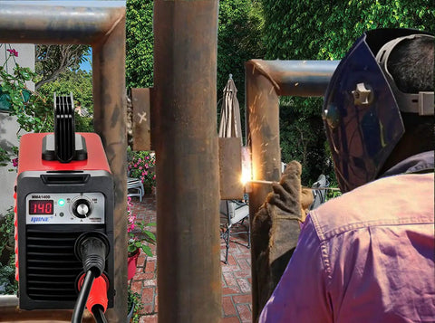Rugged 110V 220V Stick Welder With 140 Amp Arc Output IGBT Inverter Digital LCD Display in use for welding metal pipes outdoors