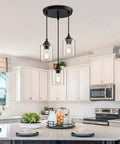 Three Light Pendant Lighting Fixture For Kitchen Island And Dining Area With Adjustable Cords And Glass Shades in Black Finish