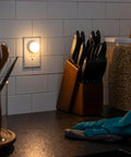 LED Night Lights Plug In Dusk To Dawn Sensor 10 Pack Soft White Nightlights in kitchen providing safe nighttime navigation.