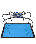 Helping Hands Soldering Station with Soldering Mat and Six Flexible Arms holding PCB on heat resistant silicone base
