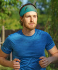 Man running wearing sweat-wicking headband for sports and workouts, ultra wide 11cm hairband, cotton-like fabric, no-slip fit