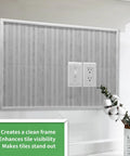 30 Ft Peel And Stick Trim For Walls And Backsplash Edges framing a tiled wall section around a power outlet, enhancing decor.