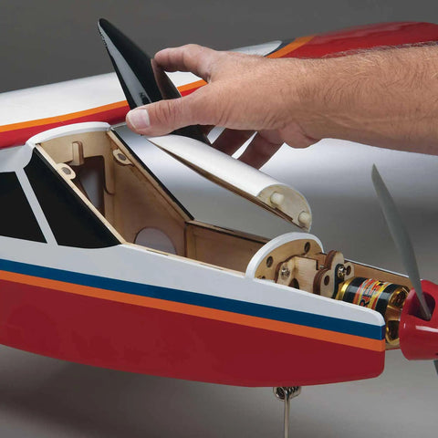 Hand assembling Avistar Elite 46-Size Almost Ready To Fly Advanced RC Trainer Airplane with visible internal structure.
