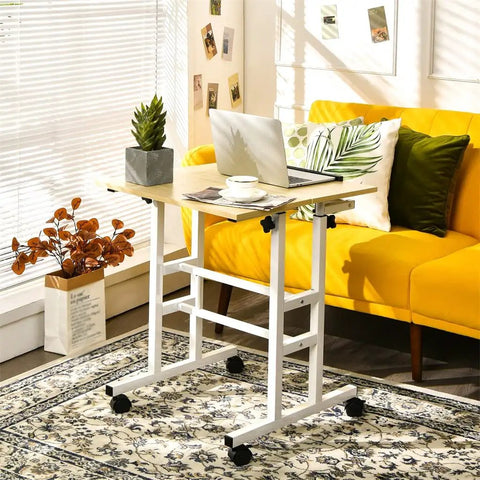 Hassle Free Rolling Height Adjustable Standing Desk With Easy Glide Casters And Extra Roomy Laptop Tray in cozy home office setup.