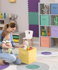 Mother and child using 11 Inch Fabric Storage Cubes With Handles Sturdy Collapsible Bins Set Of 6 Foldable Baskets in pastel colors