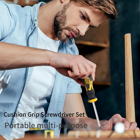 Ultimate Multi-Purpose Screwdriver Set With Ergonomic Non-Slip Cushion Grip Handle Designed For Heavy Duty Work and Precision Repairs While Reducing Hand Fatigue And Delivering Rock Solid Control On All Fastening Tasks Even In Messy Wet Or Oily Conditions. man using yellow and black screwdriver