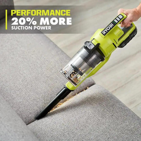 Heavy Hitting Cordless Stick Vacuum Cleaner With 18 Volt Battery And Quick Charger features a vacuum cleaning sofa gaps for debris.