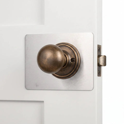 Top Grade Stainless Steel Door Lock Reinforcer Plates With Easy Install Adhesive Backing Perfect For Fixing Shaky Handles And Deadbolts While Boosting Home Security Plus Adding A Nice Decor Touch Without Screws Needed At All on white door knob