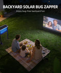 Outdoor Solar Bug Zapper For 3000 Sq Ft Coverage next to family watching movie on a lawn, showing backyard use and placement.