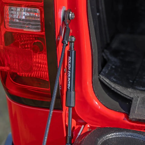 Hydraulic Tailgate Assist For Chevy Silverado And GMC Sierra 1500 2500HD 3500HD 2007 To 2018 installed on red tailgate