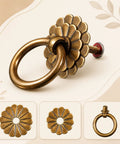 Close-up of a Six Piece Antique Brass Cabinet Ring Pulls Bringing A Flat Out Vintage Drop Ring Vibe To Your Kitchen Cabinets Ideal For Fast Furniture Refreshes And Smooth Daily Access with floral backplate.