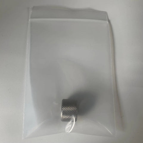Premium 1/2X28 Barrel Thread Protector Nipple in a clear bag, solid stainless steel, ½-28 threads, for firearm protection.