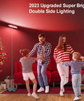 Family dancing near Two-Sided Smart Floor Lamp With RGBCW Color, 2000 Lumens, Alexa and Google Home Ready, 66 Inch Tall, Black.