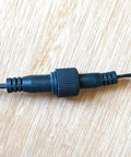 Close-up of connector on 33Ft 100 LED Outdoor Waterproof String Lights Warm White for 12V Low Voltage Landscape Lighting Not Compatible With 120V