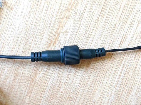 Close-up of connector on 33Ft 100 LED Outdoor Waterproof String Lights Warm White for 12V Low Voltage Landscape Lighting Not Compatible With 120V