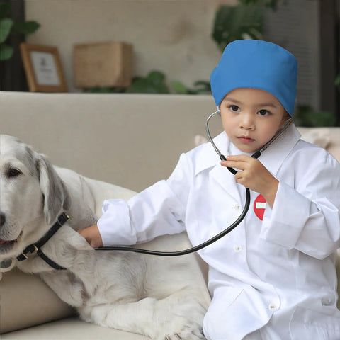 Child in Kid Friendly Doctor Costume Set With Lab Coat Scrubs Real Stethoscope 7 Piece Dress Up Kit examining dog
