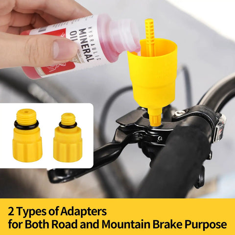Using Brake Bleed Kit For Shimano Hydraulic Brakes With Mineral Oil 120ml showing adapters on bike brake lever.