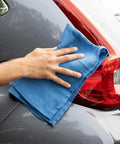 Hand using Virgin Surgical Lint Free Blue Cotton Huck Towels 5 lb Box 16 by 25 Inch on car surface for polishing