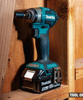 No-Bull 18 Volt Cordless Impact Driver Built Around A Brushless Motor And Four Speed Quick Shift Mode Delivering Up To Three Thousand Six Hundred Rpm For Nitty Gritty Fastening Work As A Raw Bare Tool Setup on wooden background showing detail.