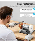 User operating Super Cool 3000-6000Rpm Mini Bench Grinder with dual grinding wheels for knife sharpening.