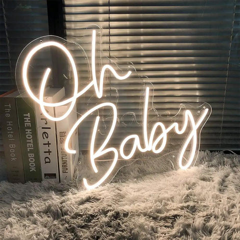 Dimmable LED Neon Sign With Transparent Acrylic Backplate, Indoor Wall Decor, "Oh Baby" text in warm white, tabletop display.