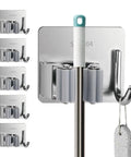 Five Pack Wall Mounted Mop And Broom Holder Set With Stainless Steel Hangers For Closet Laundry Garage And Garden Tools Organization Boss Level Rust Resistant 304 Stainless Steel Durable Space Saving, showing five holders and hangers with a handle and cleaning tool.