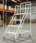 Rock Solid Rolling Warehouse Ladder With Spacious Work Platform And Slick Glide Casters Portable Industrial Step Stool For Adults in a warehouse setting.