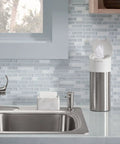 Brushed Nickel Kitchen Sink Soap Dispenser 16oz Refillable Sleek Contemporary Vibe For Liquid Soap And Dishwashing Liquid Easy Install In Pre Drilled Sink next to faucet on kitchen counter.