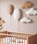 5 Piece Nursery Wall Decor Set With Fabric Cloud Balloons And Linen 3D Hot Air Balloons above a crib in baby room