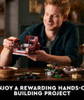 Man assembling Icons 10290 Pickup Truck Building Set For Adults with Vintage 1950s Style, showing engine and front details.