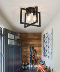 Three Light Dope Industrial Black Ceiling Light Fixture Semi Flush Mount Chandelier in rustic entryway with open door.