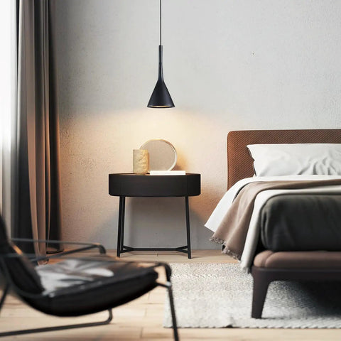 Bedroom scene with Industrial Adjustable Pendant Light Matte Black 3 Lamp Dope Retro Vibe Vintage Cone Fixture over nightstand.