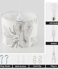 Plug In Pendant Light With 15 Ft Adjustable Hanging Lamp Cord And Toggle Switch, Floral Fabric Shade close-up with LED bulb.