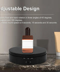 3 In 1 Electric Rotating Display Stand With Smooth 360 Turntable And Remote For Dynamic Product Photos Jewelry Showcase Live Videos 22 Lbs Capacity showcasing a cosmetic bottle on a black turntable.