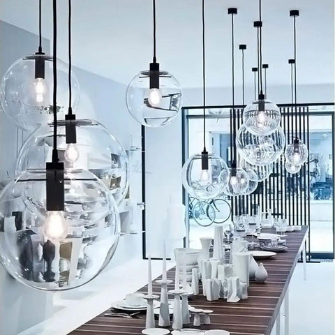 Industrial Clear Glass Globe Pendant Light E27 hanging above a modern dining table, adjustable 59 inch cord, UL listed